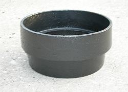 Cast riser for water valve covers, a black cast-iron ring