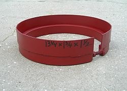 Riser for sewer clean-out covers, a red steel ring